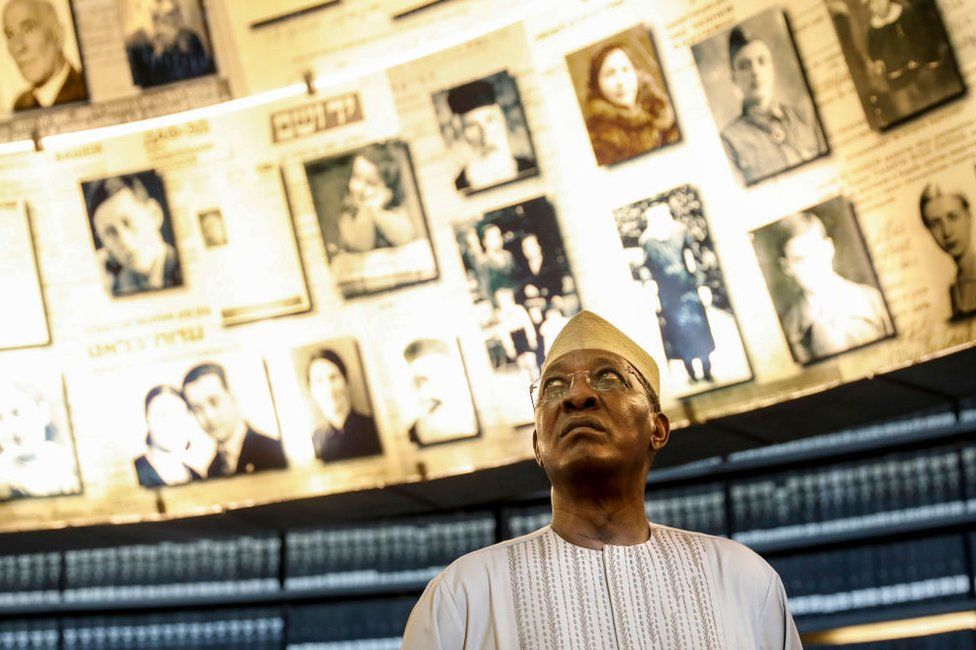 Chadian President Idriss Deby looks at pictures of Jewish Holocaust victims at the Hall of Names during his visit to the Yad Vashem Holocaust Memorial museum in Jerusalem, Israel - 26 November 2018