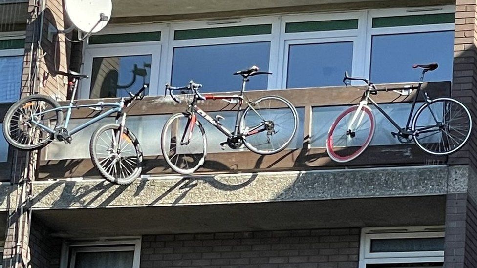 Bikes hanging from a balcony