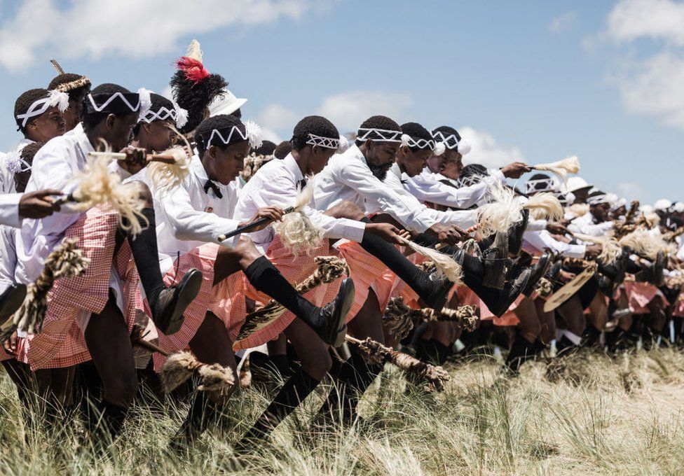 Followers of the Nazareth Baptist Church, from the Ekuphakameni group, also known as the Shembe Church, dressed in traditional attire, take part in a cultural dance on the Nhlangakazi Holy Mountain in Ndwedwe - Sunday 8 January 2023