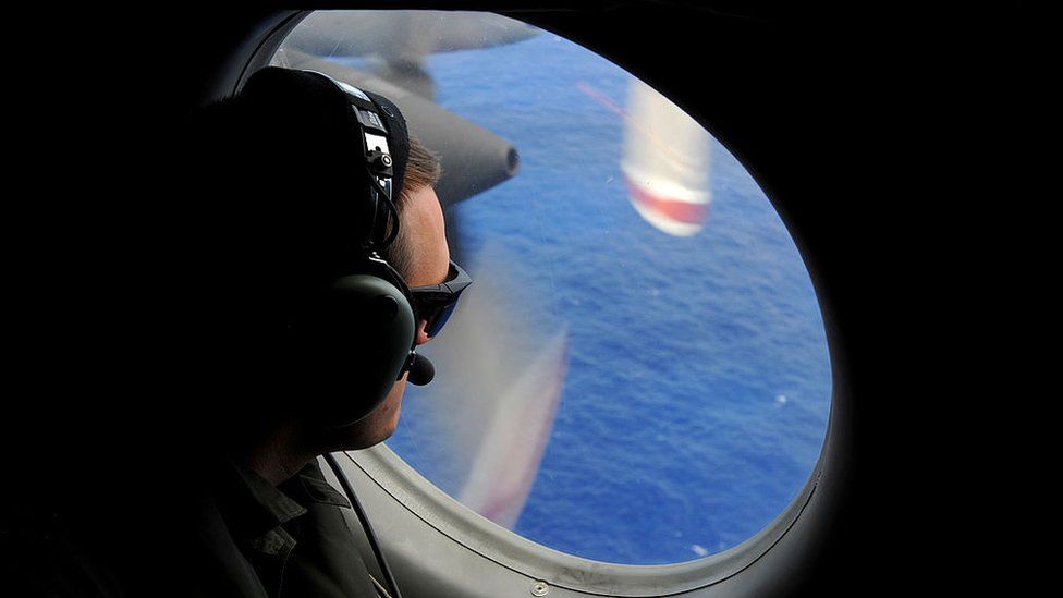 A search crew involved in the hunt for MH370