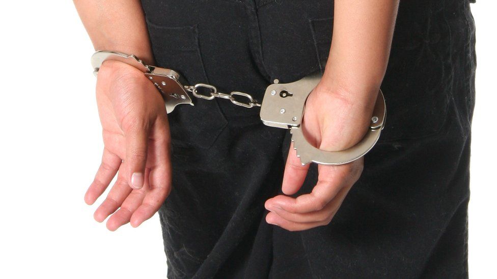 Female child in handcuffs
