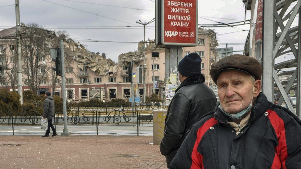 A local man reacts standing in front of a destroyed building after shelling in Chernihiv, Ukraine, 27 March 2022