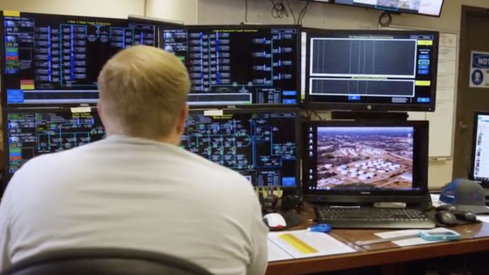 man at pipeline terminal