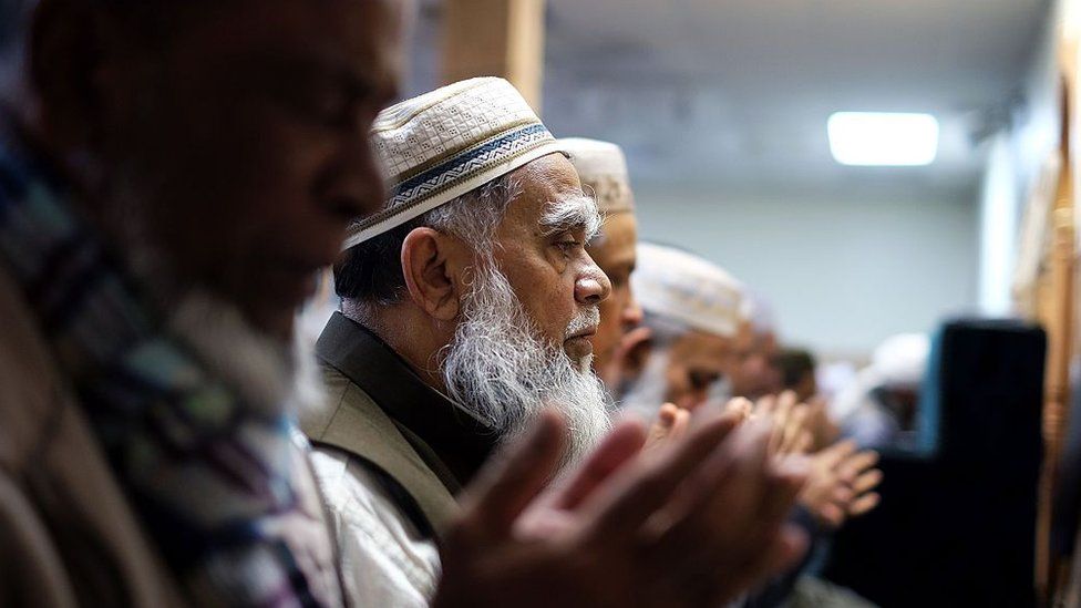 Muslim men pray during their weekly Friday noon special prayer at the Al-Islah Islamic Center Mosque in Hamtramck, Michigan.
