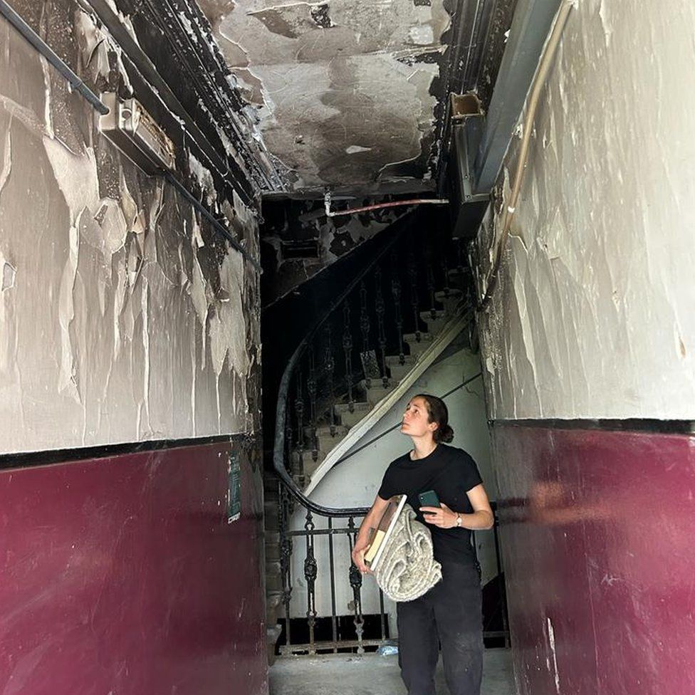 Carina Haouchine in fire damaged tenement