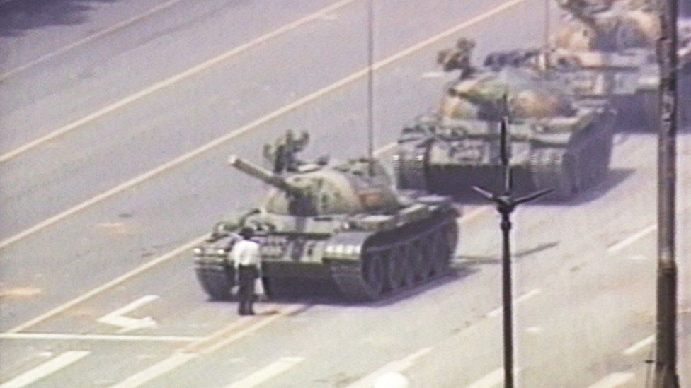 A lone demonstrator stands in front of tanks in Tiananmen Square, Beijing (5 June 1989)