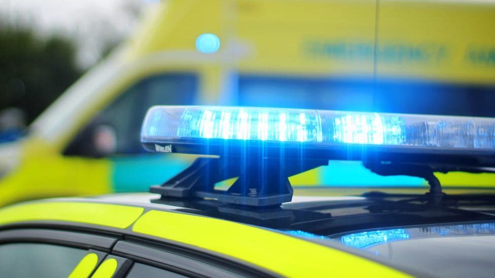 Stock image of a police car and ambulance