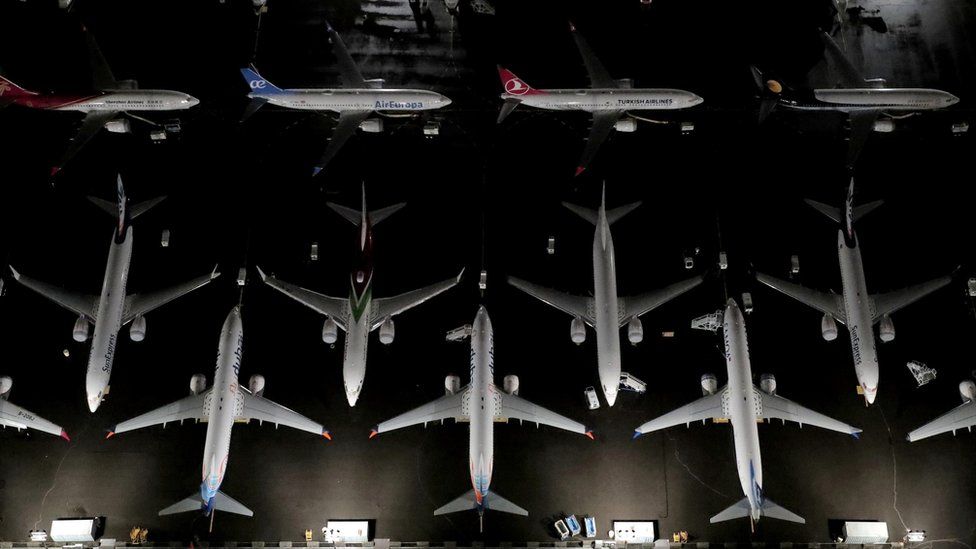 Planes parked on tarmac