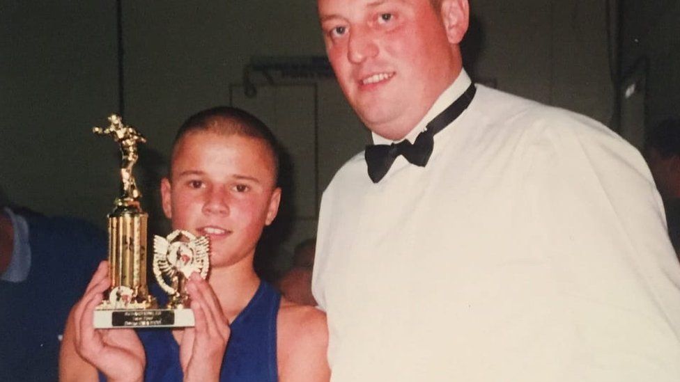 Darren Sullivan winning boxing trophy as a child