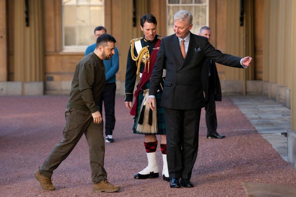 Ukrainian President Volodymyr Zelensky is greeted by Sir Clive Alderton, Principal Private Secretary to King Charles III, as he arrives for an audience with the King at Buckingham Palace