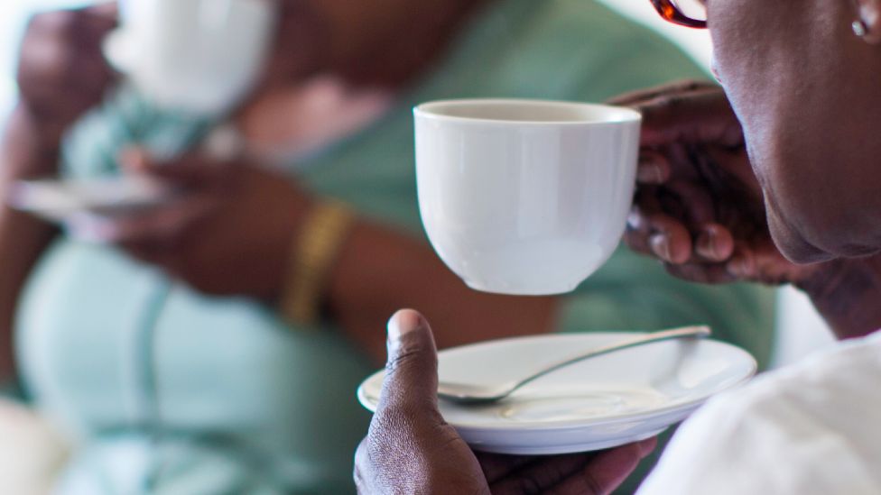 Two women in South Africa drinking tea