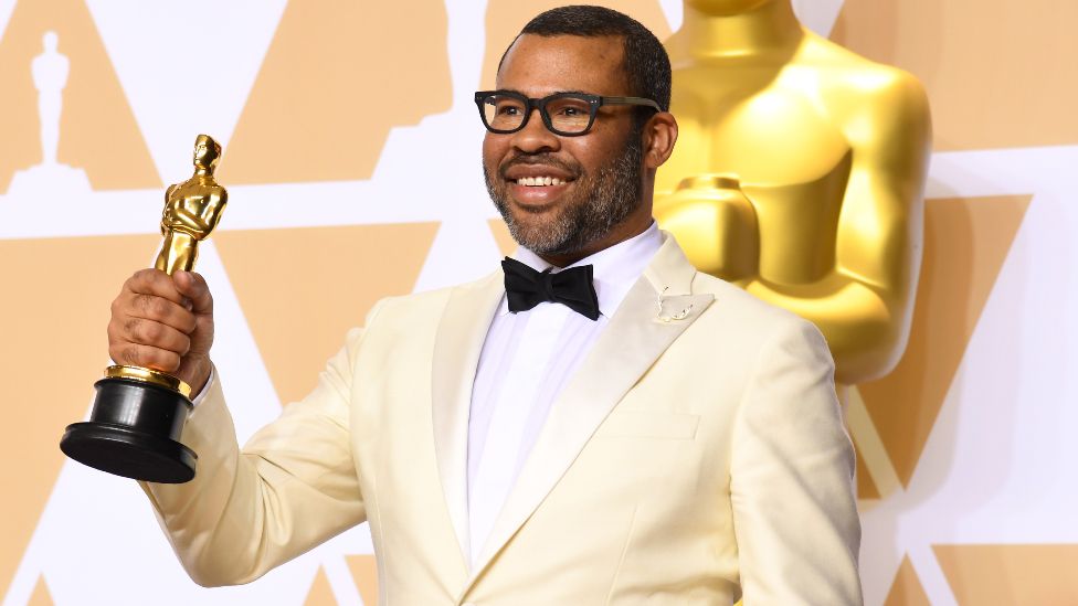 Jordan Peele with his Oscar for best original screenplay at the Academy Awards in 2018
