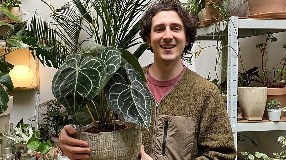 Giacomo Plazzotta with a plant