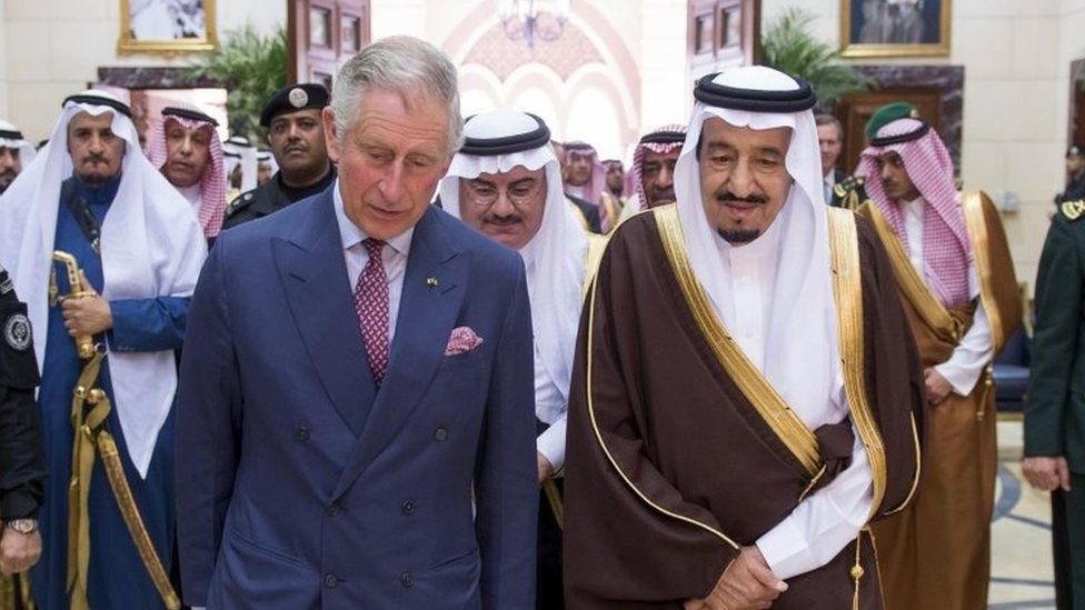 Britain's Prince Charles (centre left) walks with Saudi King Salman at the Al Ergah Palace in Riyadh (10 December 2015)