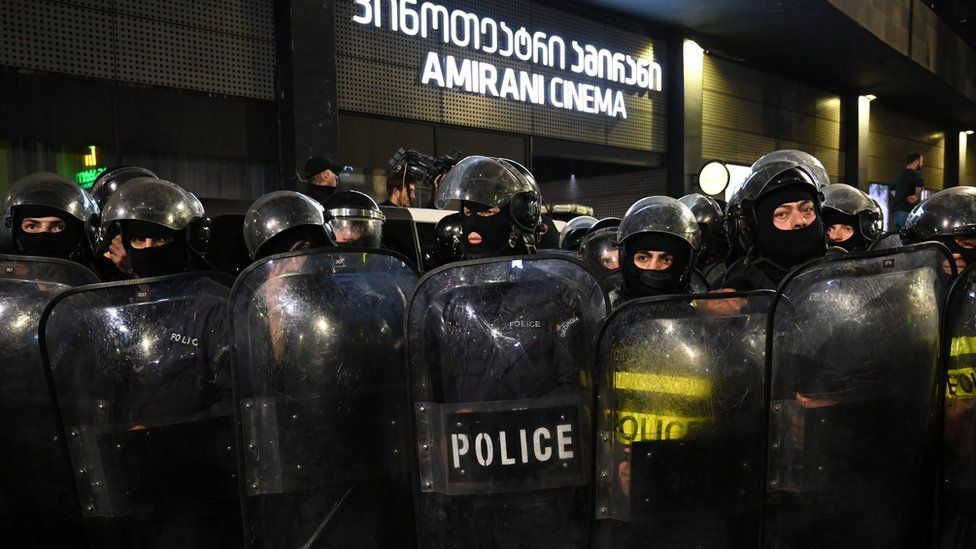 Georgian police officers stand guard in front of the Amirani cinema as far-right activists protest against the premiere screening of an Oscar-nominated Swedish-Georgian gay film in Tbilisi on November 8, 2019