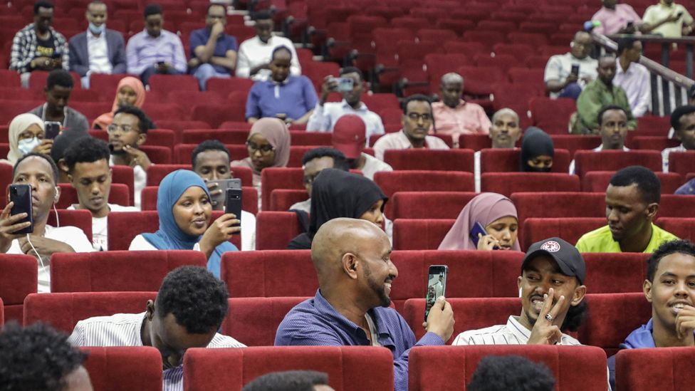 Viewers wait for the first screening of Somali films at The Somali National Theatre in Mogadishu, Somalia - 22 September 2021