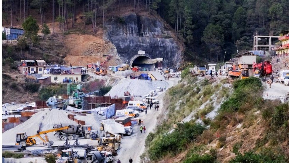 A general view outside the entrance of a tunnel where rescue operations are in progress after workers were trapped in a collapse of an under construction tunnel, in Uttarkashi, in the northern state of Uttarakhand, India, November 24, 2023