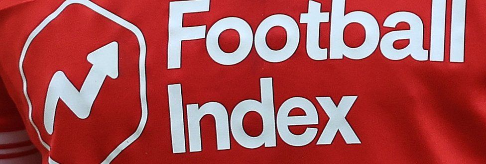 The Football Index logo and company name in white writing on the red Nottingham Forest 2020-21 home shirt