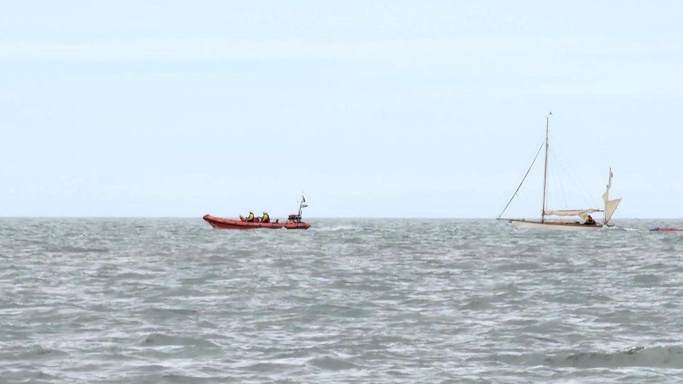 The yacht being towed by Harwich Lifeboat