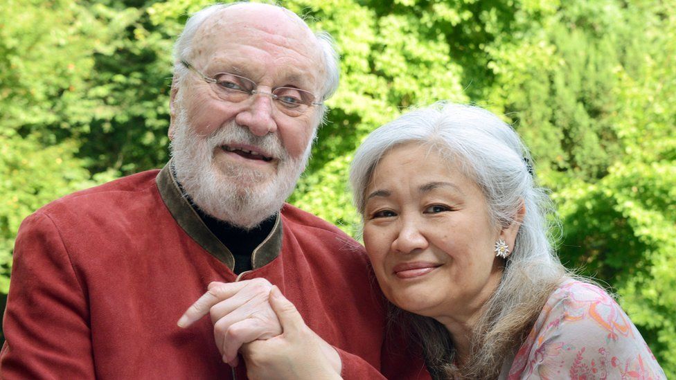 Conductor Kurt Masur poses with his wife Tomoko Sakurai-Masur in the garden of his house in Leipzig, eastern Germany. June 2014