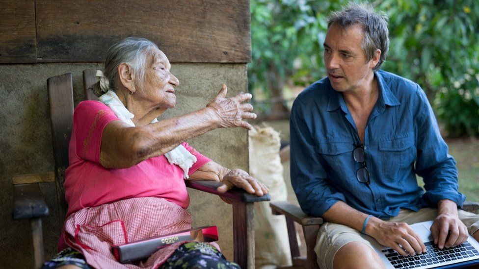 Elderly woman talking to Dan Buettner