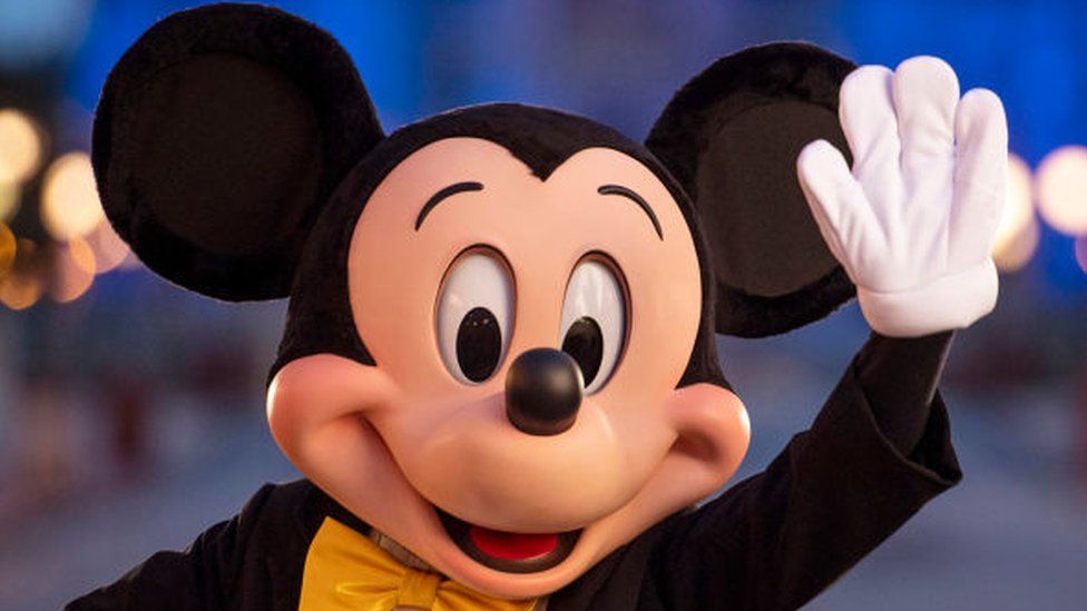 Walt Disney World Resort, Mickey Mouse pauses on Main Street.