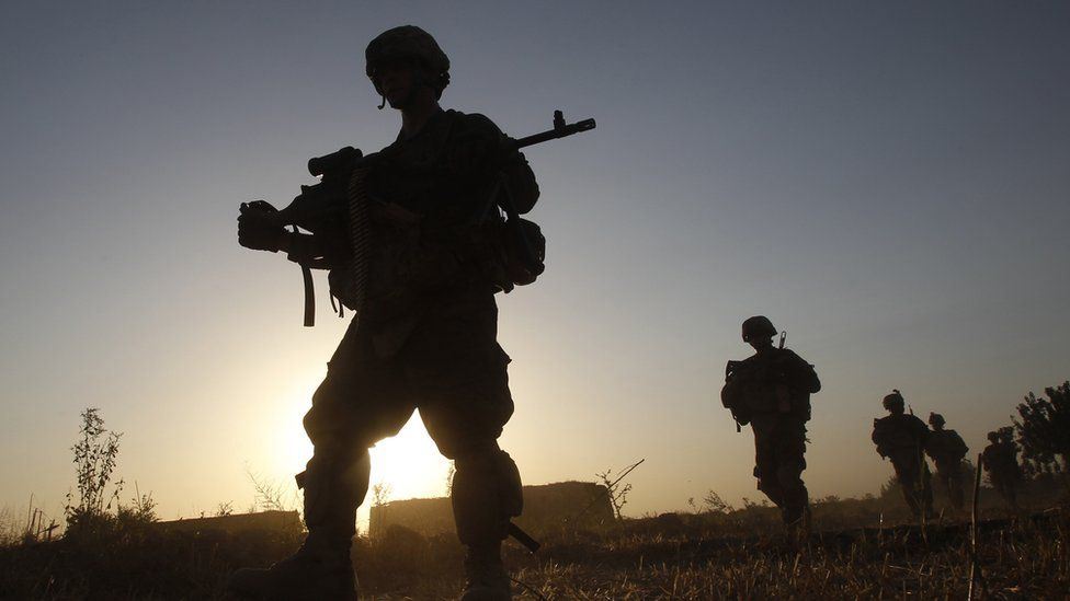 A silhouette of soldiers