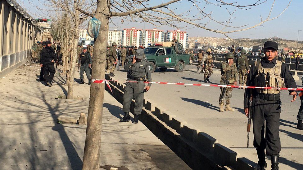 Afghan security officials secure the site of a suicide bomb blast near a defence ministry gate, in Kabul, Afghanistan, 27 February 2016.