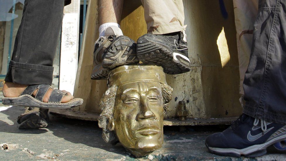 The Gaddafi statue is torn down in Tripoli in Libya on 23rd August 2011.