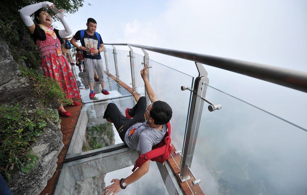 People take photos on the glass walkway (1 Aug 2016)