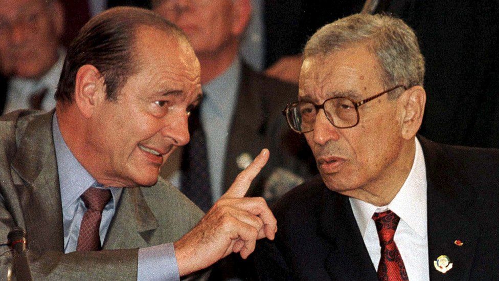 Former U.N. Secretary-General Boutros Boutros-Ghali (R) chats to then-French President Jacques Chirac (L) at the Francophone Summit in Hanoi, in this November 14, 1997