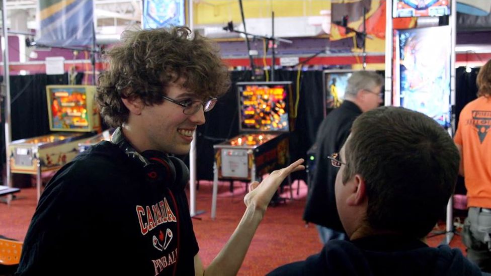 Robert Gagno talking to a fellow competitor at a tournament