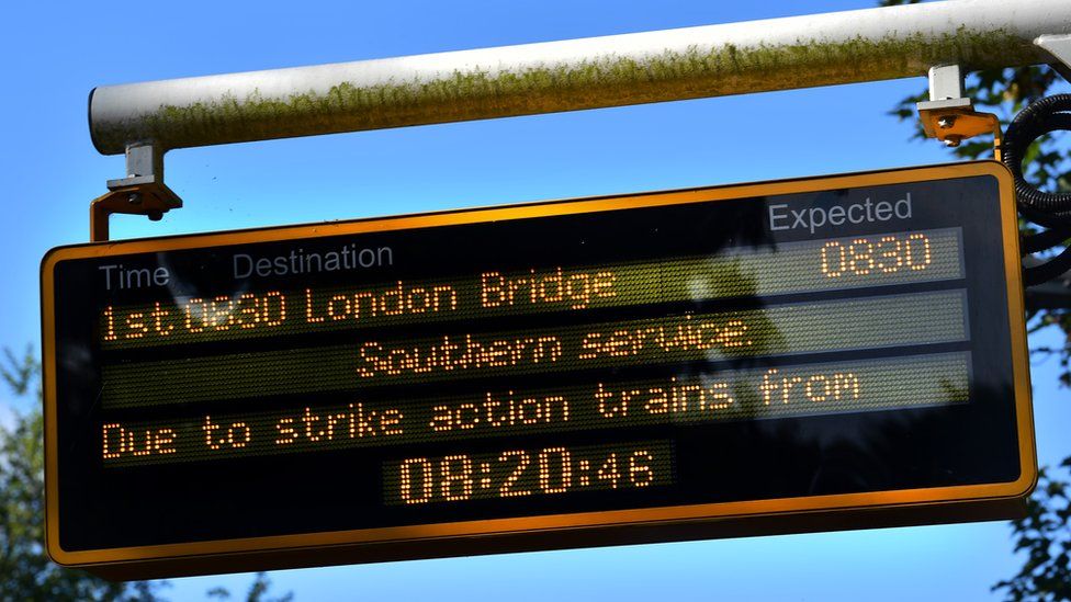 A board displays cancellations of Southern trains