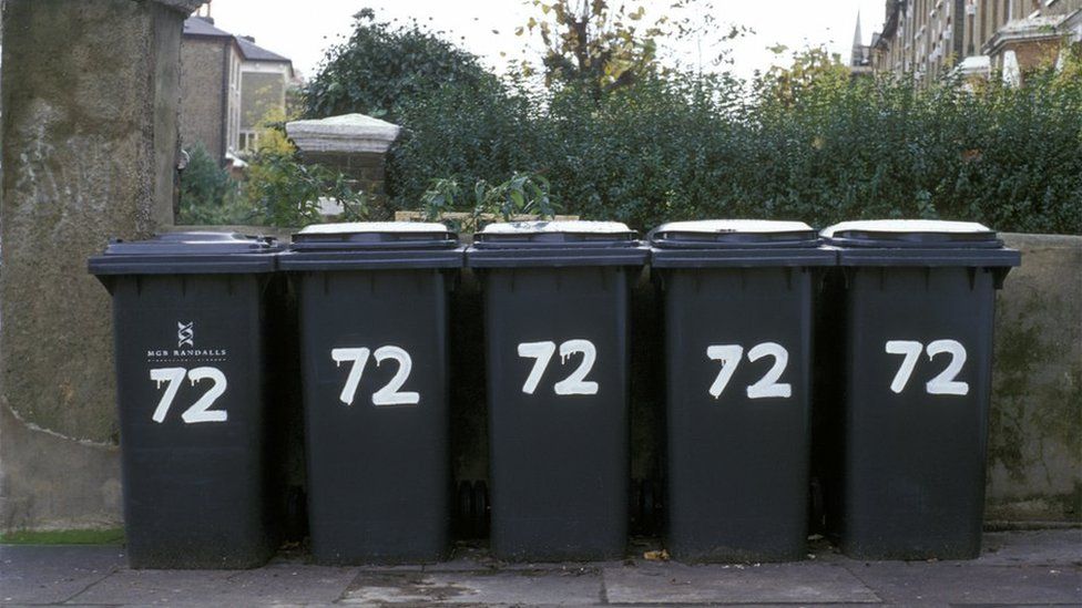Five wheelie bins all belonging to one property