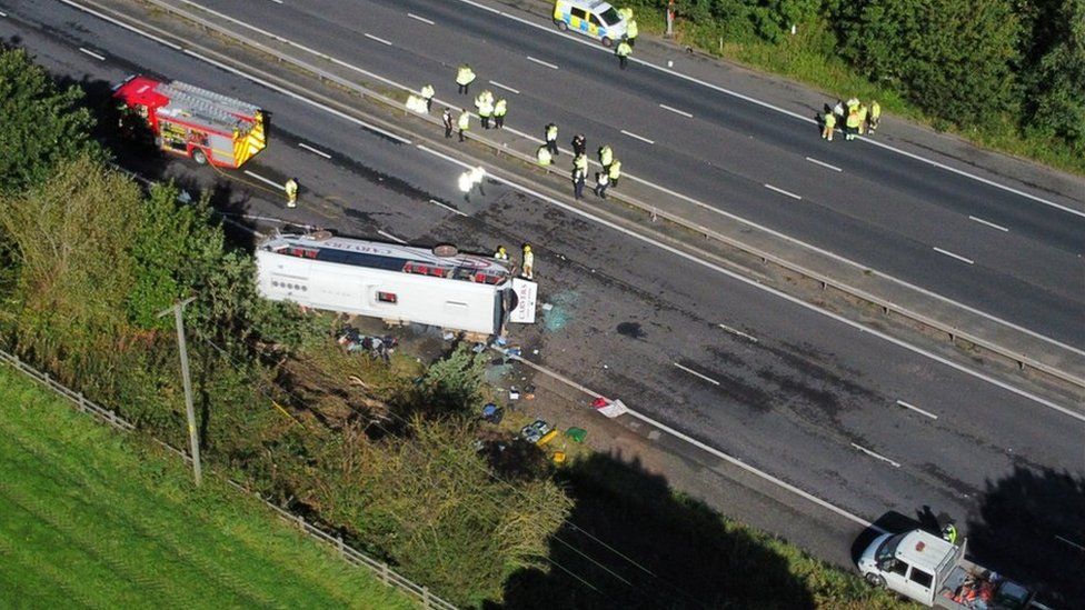 Emergency services at the scene of a coach crash on the M53 motorway