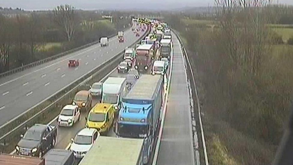 M4 delays after vehicle crashes off motorway - BBC News