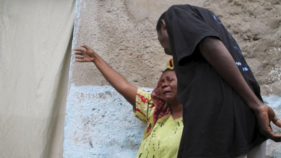 A woman in the Nyakabiga district mourns her son, who has been shot dead