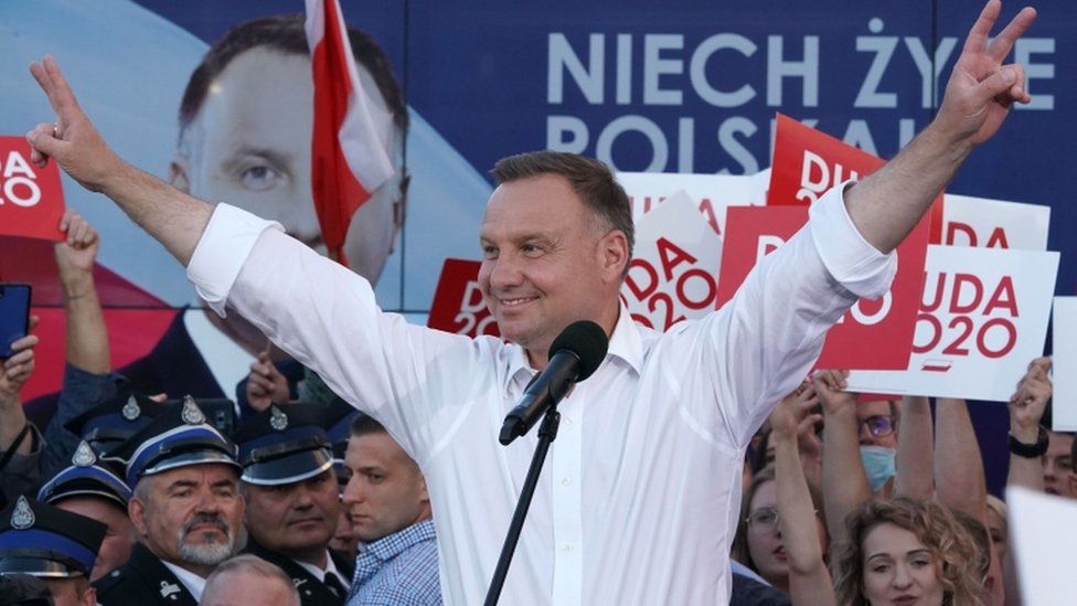 Polish President Andrzej Duda raising his arms on the campaign trail, July 2020