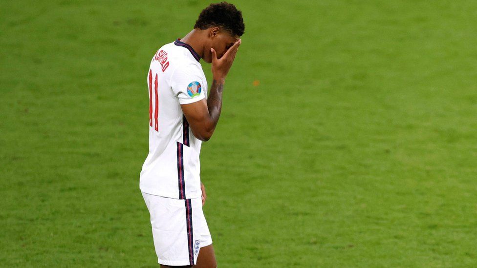 England's Marcus Rashford looks dejected after he misses a penalty during the shoot-out