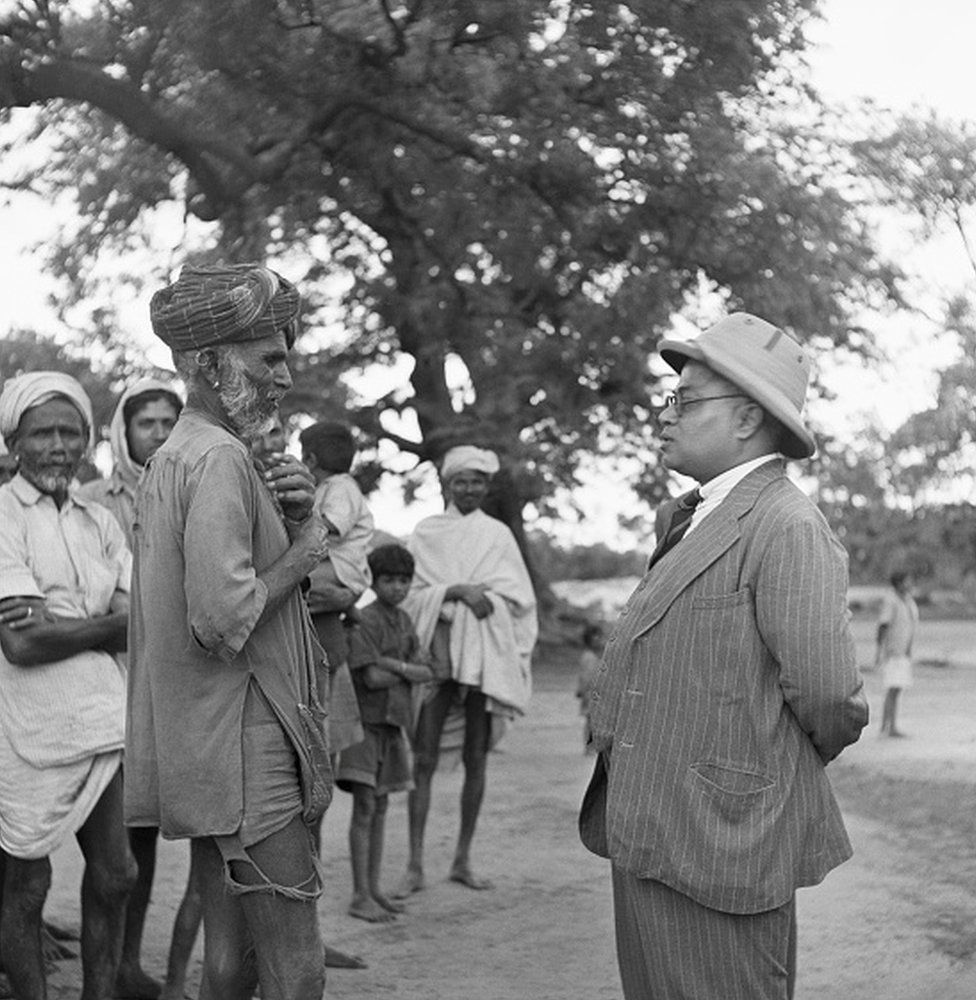 A leader of those formerly considered untouchable discusses a food shortage with a government official. Bengal Province, British India. | Location: Bengal Province, British India