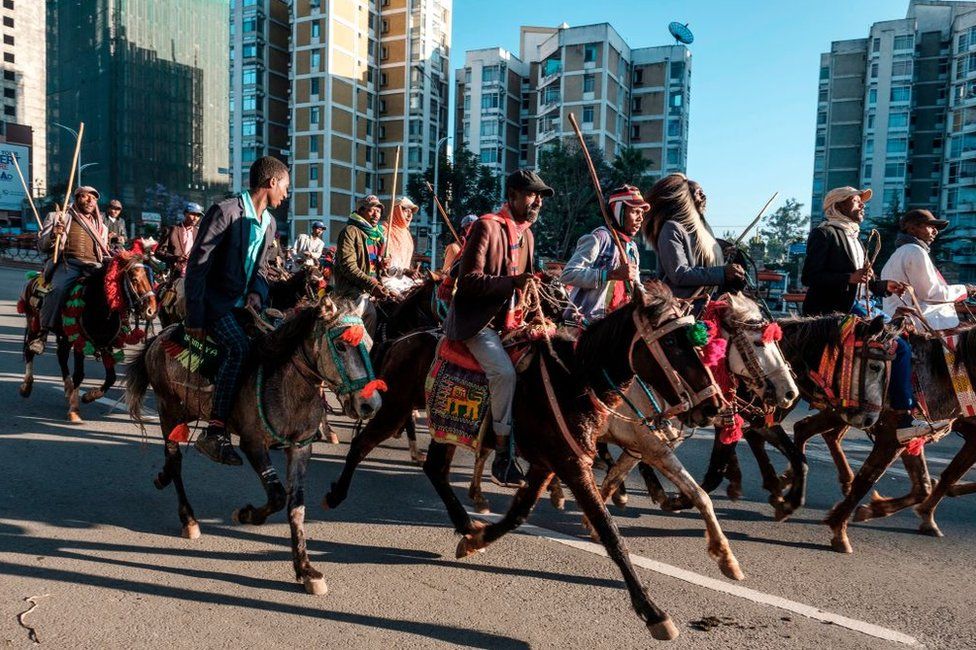 Horsemen trot through Ethiopia's capital Addis Ababa.