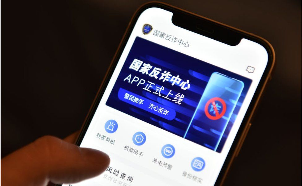 The 'National Anti-fraud Centre', an app developed by China's Public Security Bureau to tackle suspicious and fraudulent calls, text messages and installed apps, is displayed on a smartphone in an arranged photograph on September 9, 2021 in Beijing, China.