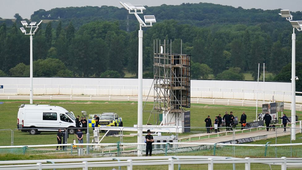 Big screen and police at Towcester Racecourse