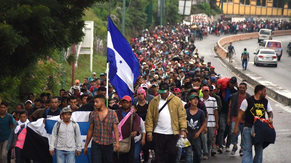Honduran migrants take part in a caravan towards the United States in Chiquimula, Guatemala on 17 October 2018
