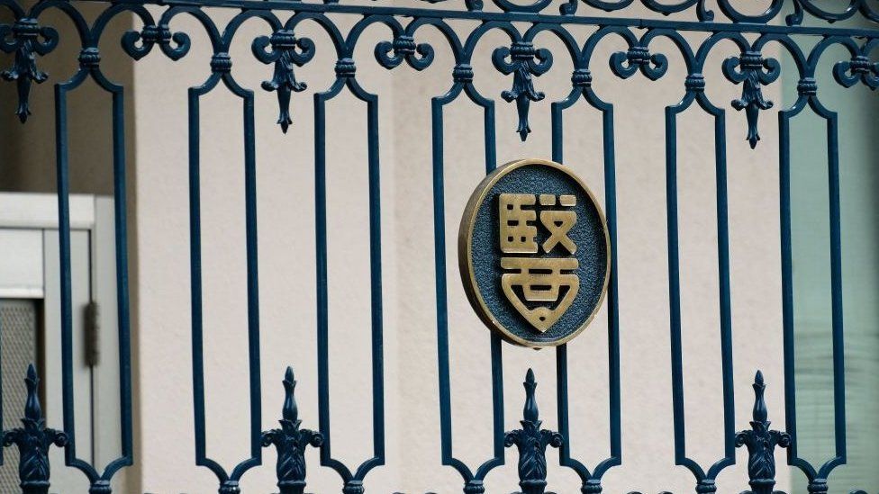 The emblem of the Tokyo Medical University is seen on the building's entrance gate in Tokyo on August 8, 2018.
