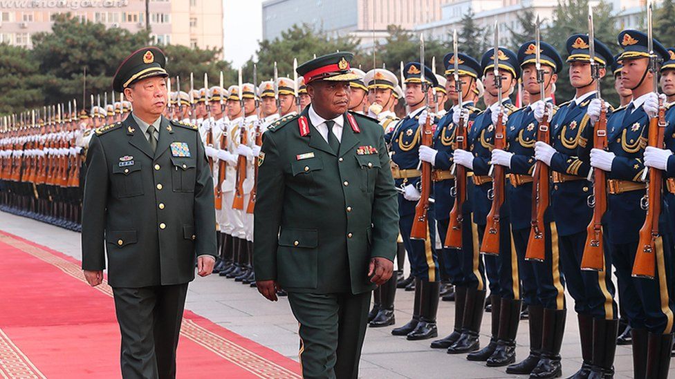 General Li Zuocheng, of China, and General Constantine Guveya Chiwenga, of Zimbabwe