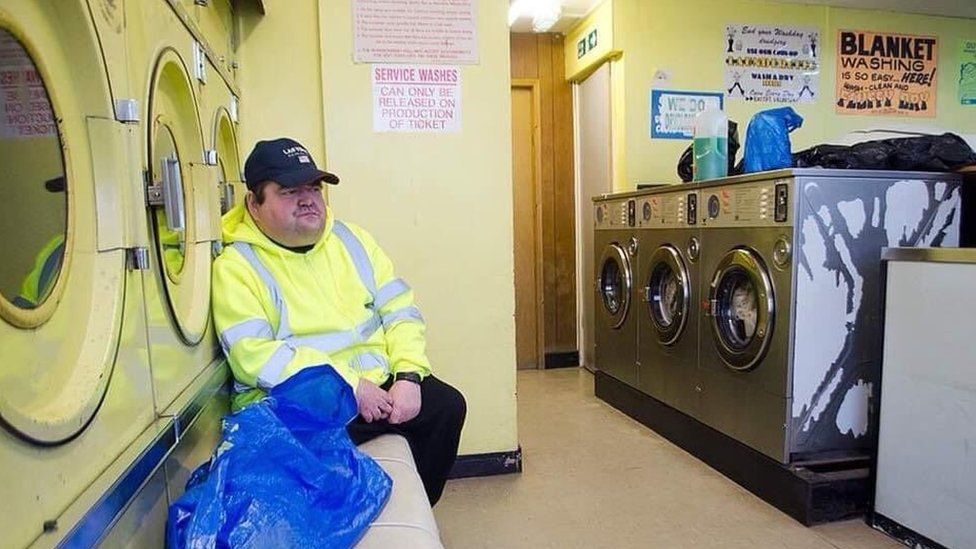 Man in launderette