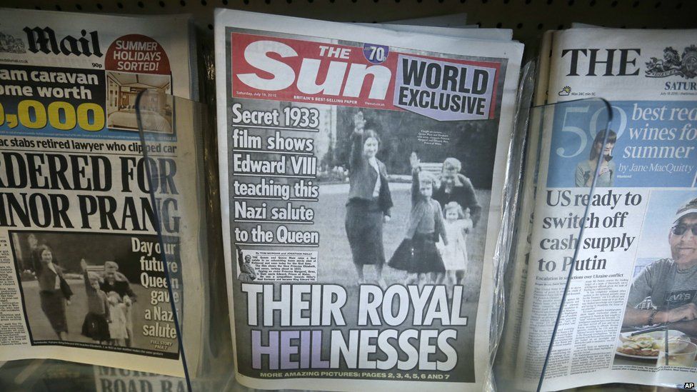 Front page of the Sun reads "Their Royal Heilnesses" and shows picture of Queen as girl doing Hitler salute