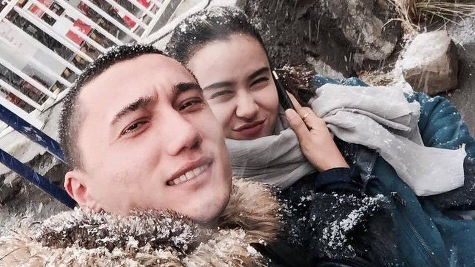 Sadam Abudusalamu and Nadila Wumaier pose for a selfie in the snow in China