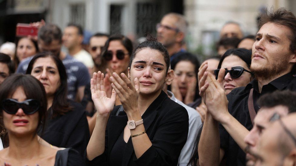 Mourners clap during the funeral of Khaled Khalifa in Damascus, Syria (2 October 2023)